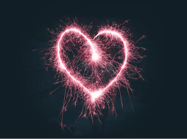 Love Languages: How to Use Acts of Service in Your Relationship 3 heart shaped pink sparklers photography